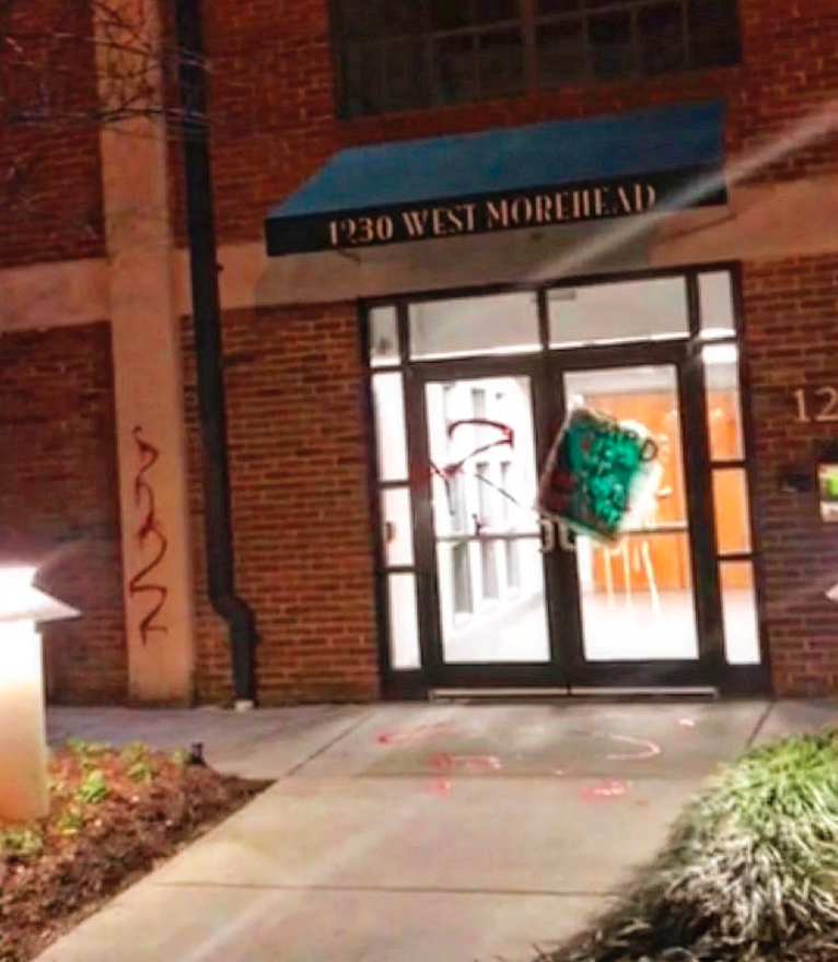 The entrance to the Boomerang Design offices at 1230 West Morehead vandalized.